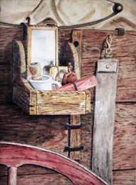 Painting of a shaving kit on an old chuck wagon.